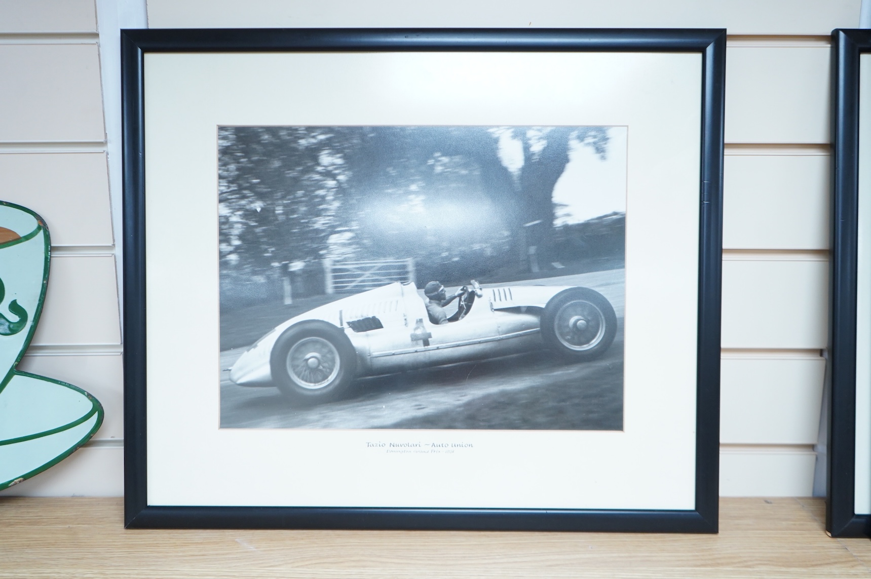Three 1930s Donington Grand Prix motor racing black and white photographs by Klemantaski, an Auto Union driven by Tazio Nuvolari, an Auto Union driven by Bernd Rosemeyer, both 28 x 38cm, and a Mercedes Benz driven by Her